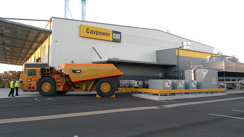 One of CAT’s “smaller mining vehicles” parked next to BAUER’s CNG45 compression and storage equipment