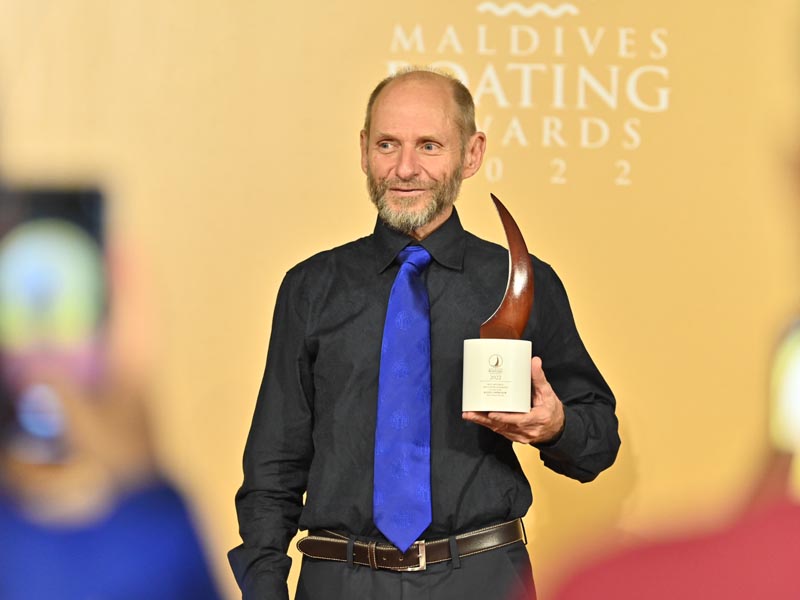 Asim Simon proudly accepting the accolade at the award ceremony